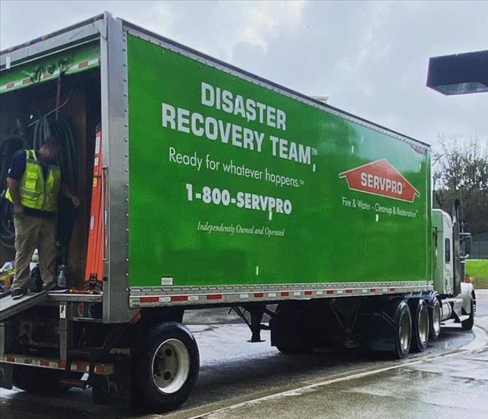 Man on the back of a SERVPRO disaster recovery truck in Pensacola, Florida