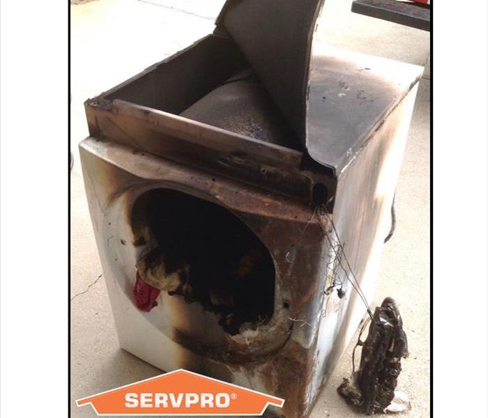 Dryer that has caught on fire with SERVPRO logo
