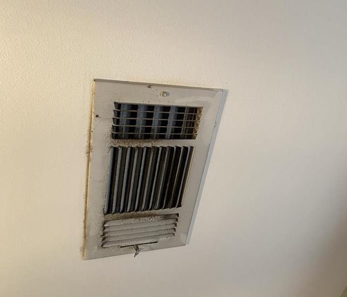 Filthy AC vent that has been collecting dust and needs to cleaned